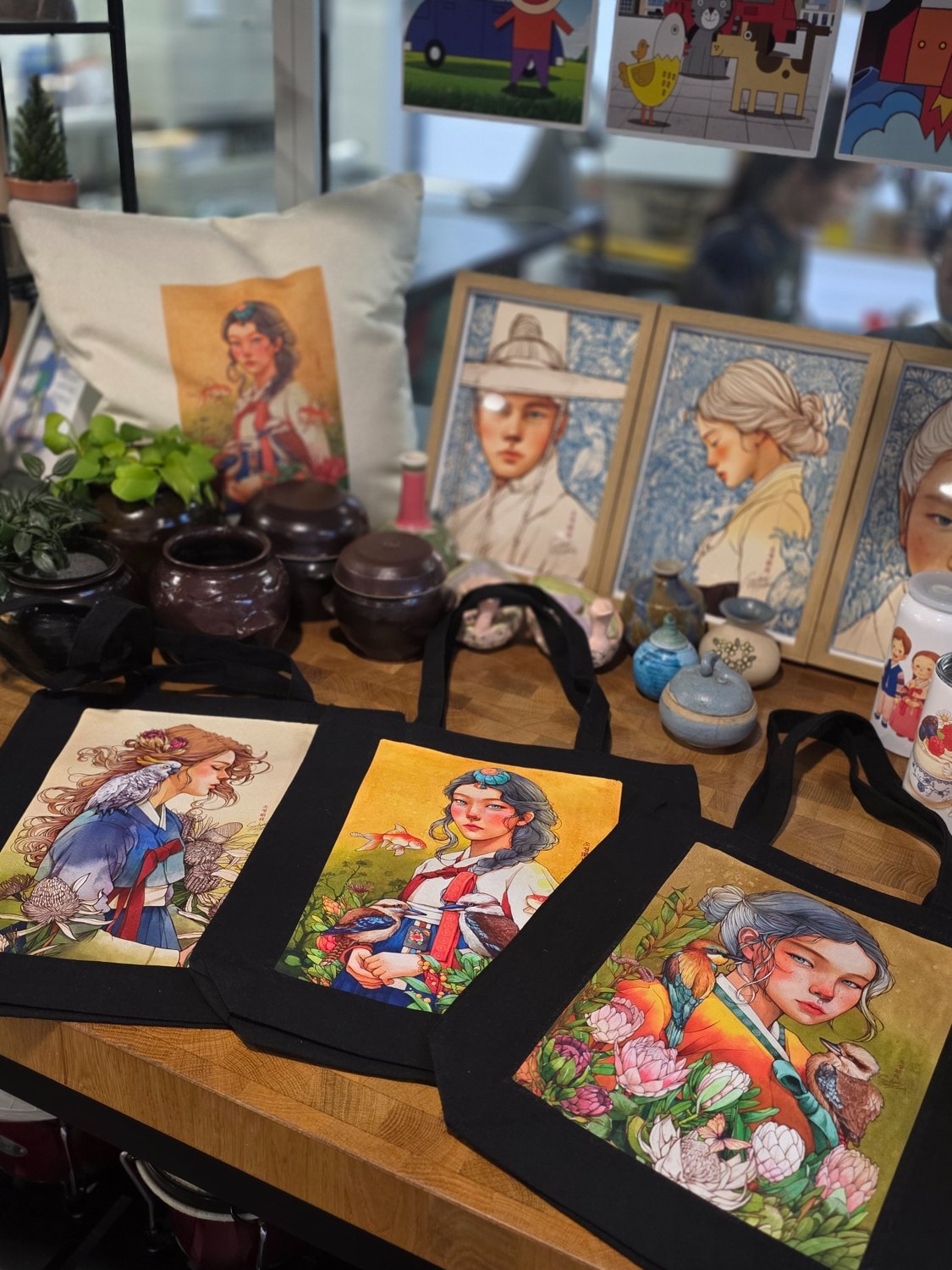 Artwork and illustrated products displayed at Eben Coffee House